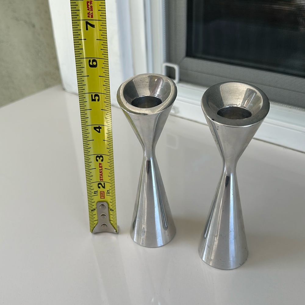 2 Nambe silver candle holder.